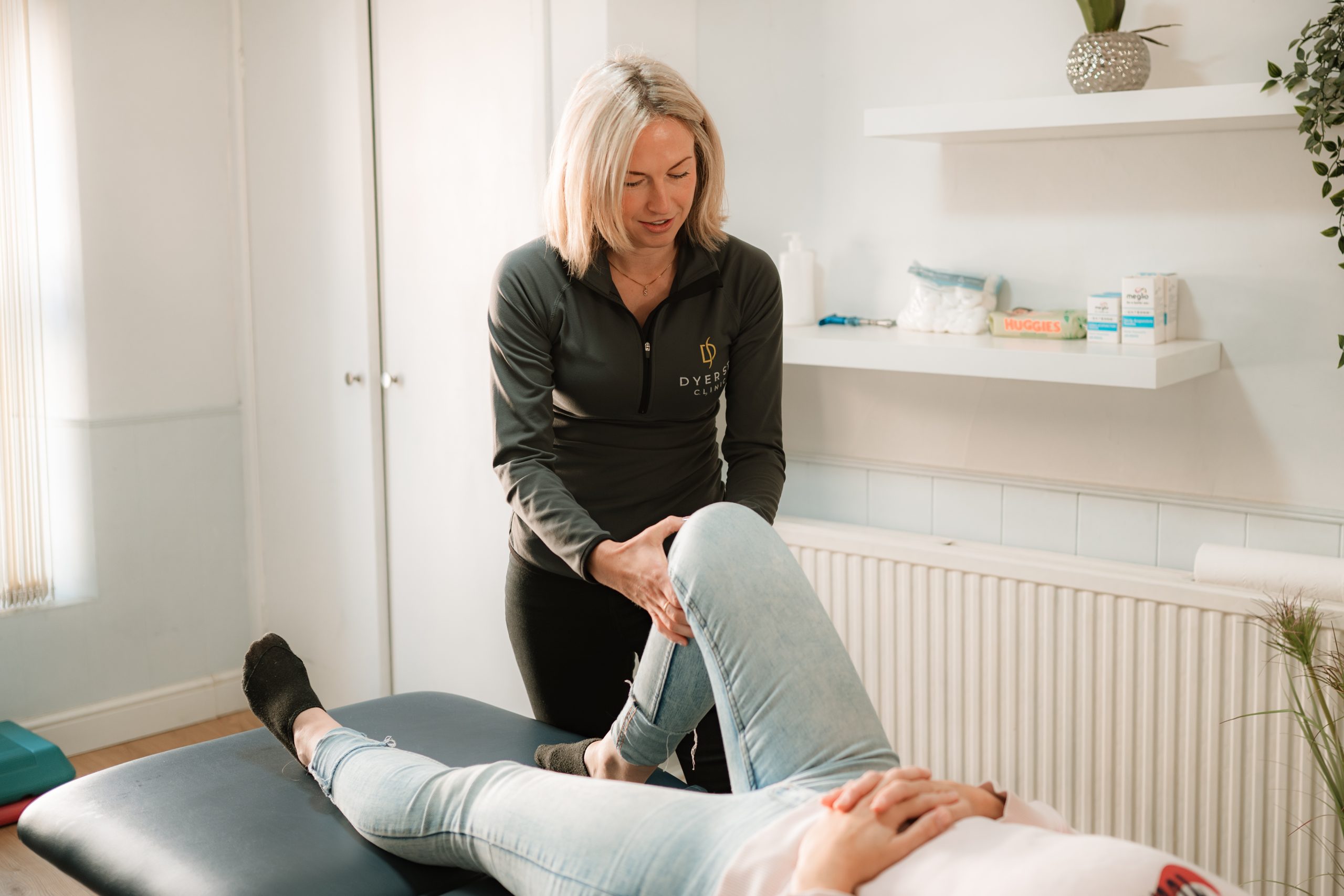 Physio Performing a knee assessment at Dyer St Clinic